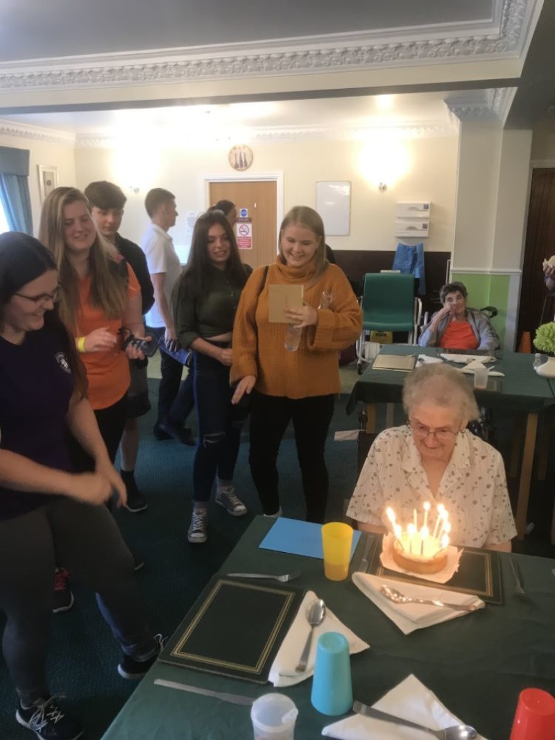 Other image for Teenage students are a hit at care home as they help Doreen celebrate her birthday